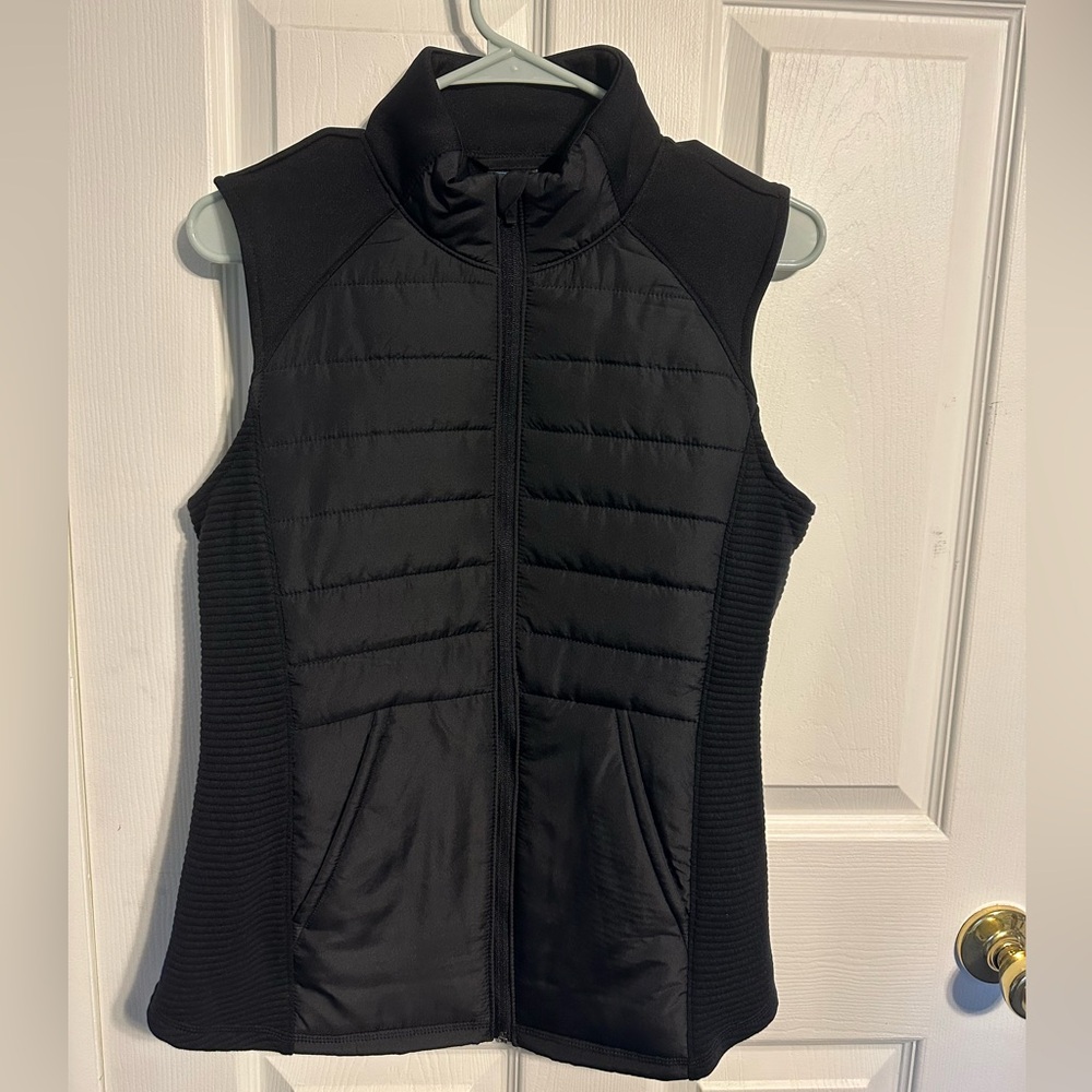 Black puffer vest with zipper and pockets